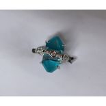 Gemporia - A 9ct white gold blue topaz, turquoise and diamond ring,