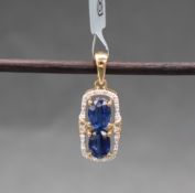 Gemporia - A 9ct gold nilamani and white zircon pendant,