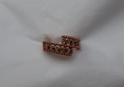 Gemporia - A 9ct rose gold diamond ring, set with twelve diamonds totalling 1ct,