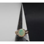 Gemporia - A 9ct gold opal and white zircon ring,