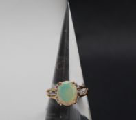 Gemporia - A 9ct gold opal and white zircon ring,