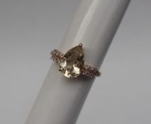 Gemporia - A 9ct gold serenite and sapphire ring,