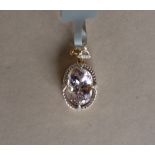 Gemporia - A 9ct gold kolum kunzite and diamond pendant,