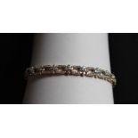 Gemporia - A 9ct gold Tomas Rae diamond bracelet, set with round cut diamonds totalling 1.