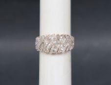 Gemporia - A 9ct gold Tomas Rae diamond ring, set with round and tapered baguette cut diamonds,