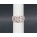 Gemporia - A 9ct gold Tomas Rae diamond ring, set with round and tapered baguette cut diamonds,