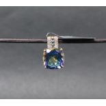 Gemporia - A 9ct gold blue topaz and white zircon pendant,