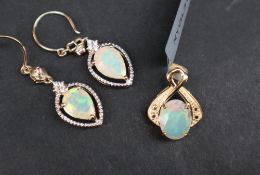 Gemporia - A 9ct gold opal pendant, set with a 1.