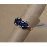Gemporia - A 9ct gold blue sapphire and white zircon ring,
