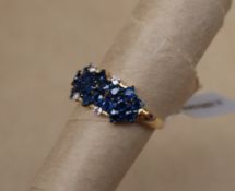 Gemporia - A 9ct gold blue sapphire and white zircon ring,