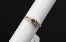 Gemporia - A 9ct gold diamond ring, set with round cut diamonds totalling 1/2ct,