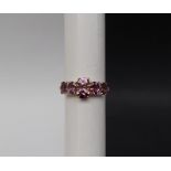 Gemporia - A 9ct gold purple spinel and diamond ring,