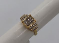 Gemporia - A 9ct gold Tomas Rae diamond ring, set with round and square cut diamonds totalling 1ct,