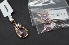 Gemporia - A 9ct amethyst and diamond pendant, set with 3.