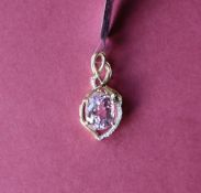 Gemporia - A 9ct gold kolum kunzite and diamond pendant, set with oval kolum kunzite,