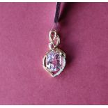 Gemporia - A 9ct gold kolum kunzite and diamond pendant, set with oval kolum kunzite,