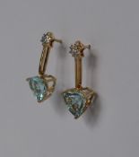 Gemporia - A pair of 9ct gold blue topaz and diamond earrings,