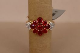 Gemporia - A 9ct gold ruby and white zircon ring,