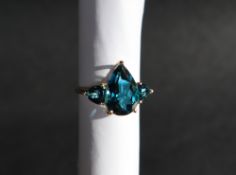Gemporia - A 9ct gold blue topaz ring, set with pear and triangle cut blue topaz,