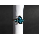 Gemporia - A 9ct gold blue topaz ring, set with pear and triangle cut blue topaz,