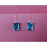 Gemporia - A pair of 9ct gold blue topaz earrings,