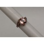 Gemporia - A 9ct gold topaz and white zircon ring,