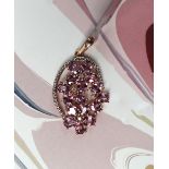 Gemporia - A 9ct rose gold pink sapphire and diamond pendant,