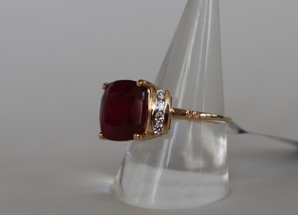 Gemporia - A 9ct gold ruby and white zircon ring,