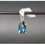 Gemporia - A 9ct white gold blue topaz and diamond pendant,