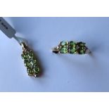 Gemporia - A 9ct gold demantoid garnet and diamond ring,