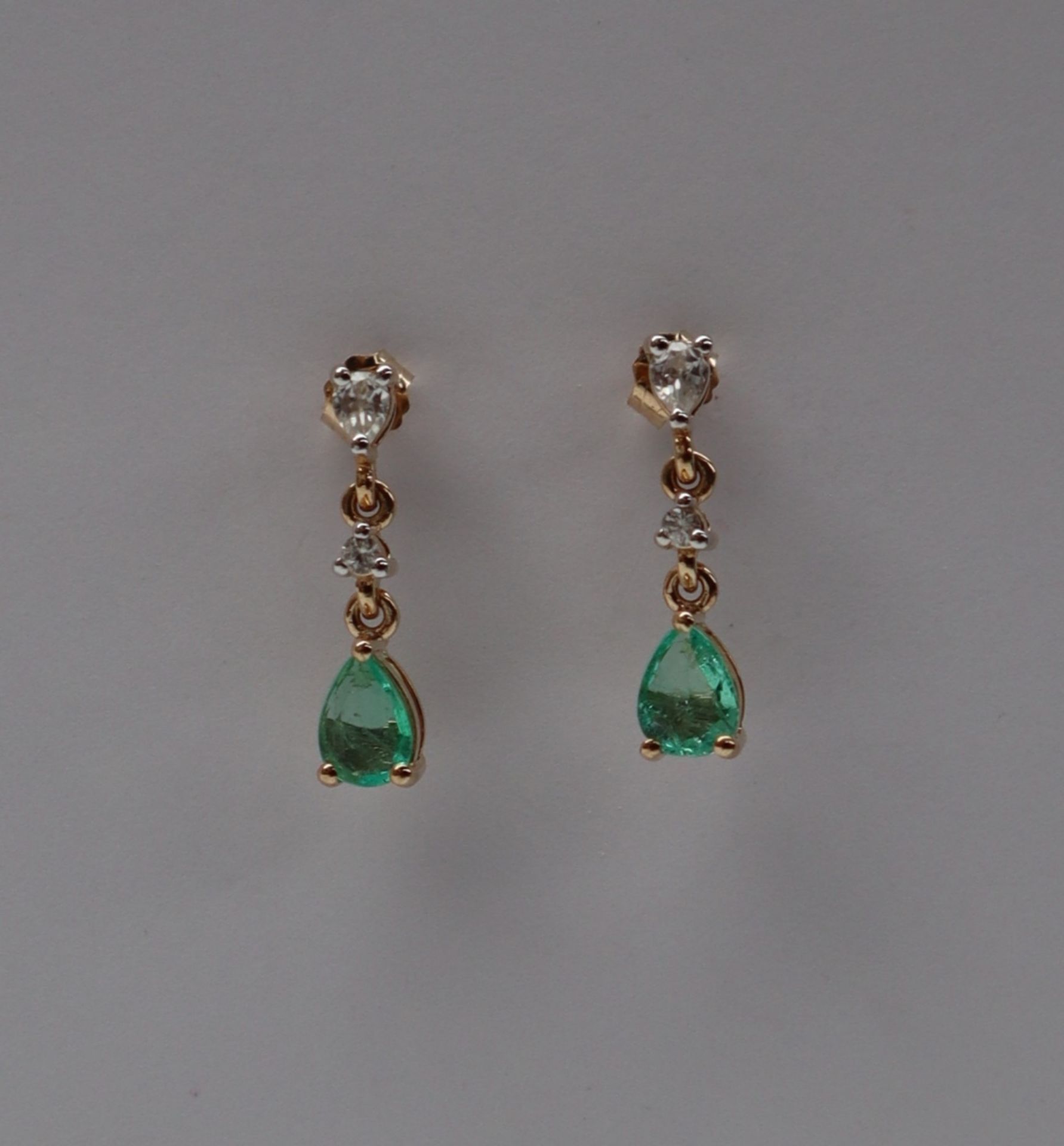 Gemporia - A pair of 9ct emerald and white zircon earrings,
