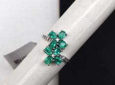 Gemporia - A 9ct white gold emerald and white zircon ring,