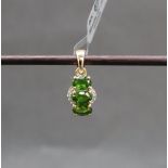 Gemporia - A 9ct gold chrome diopside and diamond pendant,