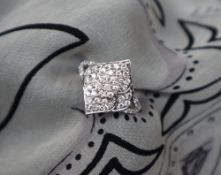 Gemporia - A 9ct white gold diamond ring, set with forty-seven diamonds totalling 0.