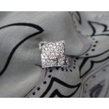 Gemporia - A 9ct white gold diamond ring, set with forty-seven diamonds totalling 0.