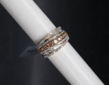 Gemporia - A 9ct gold diamond ring, set with round and tapered baguette cut diamonds totalling 1.