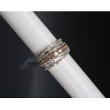 Gemporia - A 9ct gold diamond ring, set with round and tapered baguette cut diamonds totalling 1.