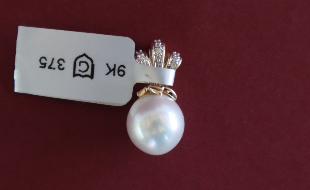 Gemporia - A 9ct cultured pearl and white zircon pendant,