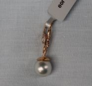 Gemporia - An 18ct cultured pearl and diamond pendant,