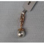 Gemporia - An 18ct cultured pearl and diamond pendant,