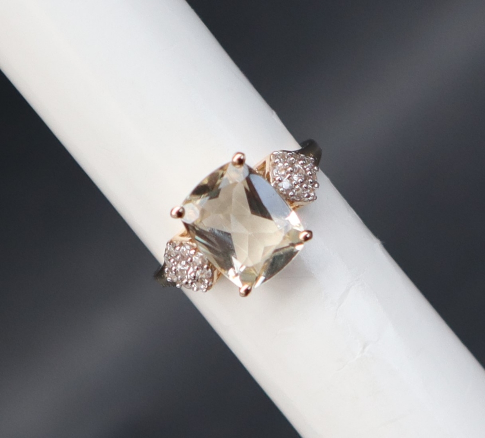 Gemporia - A 9ct gold serenite and white zircon ring,