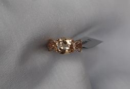 Gemporia - A 9ct gold serenite and diamond ring,