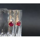 Gemporia - A pair of 9ct gold ruby and white zircon earrings,