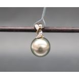 Gemporia - A 9ct gold cultured pearl and diamond pendant, set with round pearl and diamonds,
