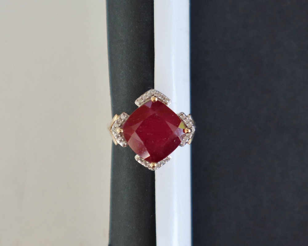 Gemporia - A 9ct gold ruby and white zircon ring,