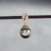 Gemporia - A 9ct gold cultured pearl and diamond pendant,