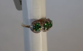 Gemporia - A 9ct gold Tsavorite Garnet and white zircon ring,