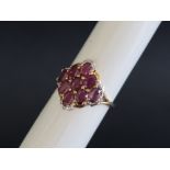 Gemporia - A 9ct gold ruby and diamond ring, set with oval cut Sant rubies and round cut diamonds,