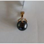 Gemporia - A 9ct gold cultured pearl and white zircon pendant,
