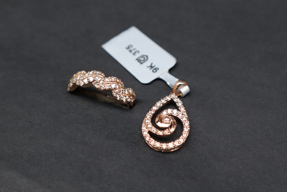 Gemporia - A 9ct rose gold pendant, set with thirty-four diamonds totalling 0. - Image 2 of 6